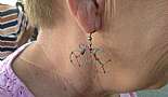 Cool earrings on a very nice lady that's into bicycles.