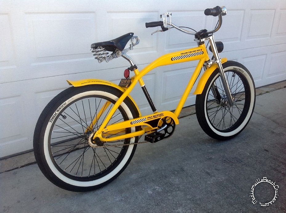 2007 Felt Taxi with double crown fork, Felt High Swoopy bars, Sturmey Archer drum brake, leather grips, Brooks B33, lay back seat post, Nirve drink caddy, chrome bicycle bell, Primo Super Tenderizer pedals, custom LED tail light, and 1954 New York license plate.